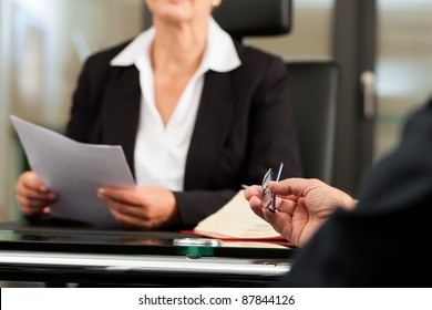 Mature Female Lawyer Or Notary With Client In Her Office For Counseling