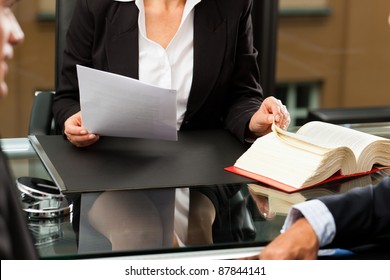 Mature Female Lawyer Or Notary With Client In Her Office For Counseling