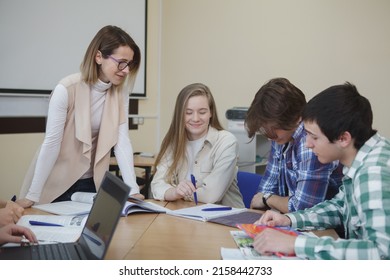 Mature Female Professor Teaching Class For College Students