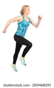 Mature Female Sportswoman During Training In Sport Gear Against White Background Indoors. Vertical Image Composition