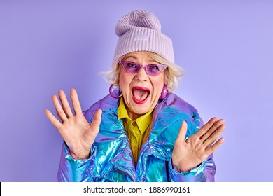 Mature Female In Stylish Outfit Stand With Opened Mouth And Spread Arms, Isolated. Happy