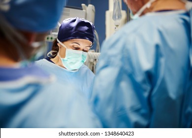 Mature Female Surgeon During An Operation