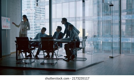 Mature financial analyst telling company development strategy on presentation using computer technology