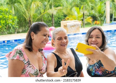 Mature Girlfriends Taking Selfies By The Pool