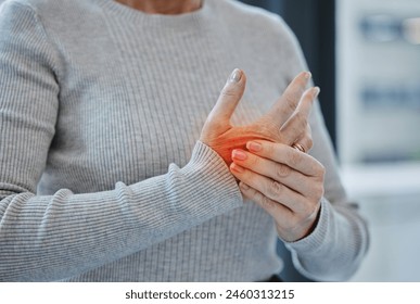 Mature, hands and pain with injury or arthritis in workplace from person, burnout and red glow in office. Tendinitis, parkinsons and muscle fatigue or carpal tunnel syndrome with inflammation. - Powered by Shutterstock