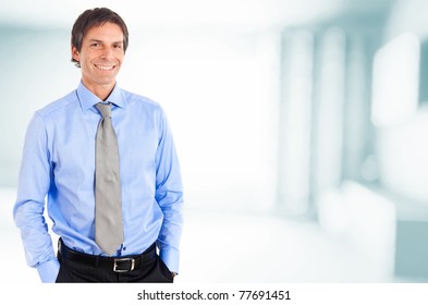 Mature Handsome Businessman Smiling In An Office Environment