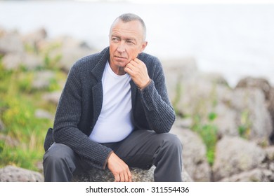 
Mature Handsome Gray-haired Man Close Up Looking At The Camera And Posing