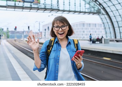 Mature Happy Woman Looking At The Camera Inside The Modern Train Station Building