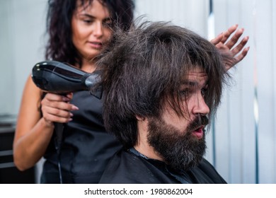 Mature Hipster With Beard At Hairdresser. Brutal Hipster With Moustache Wash Hair Before New Hairstyle. Barbershop. Male Trendy Hairdo. Perfect Haircut. Barber Master Blow Dry Hair