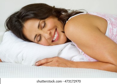 Mature Hispanic Woman Getting A Good Night Of Sleep