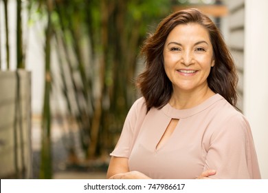 Mature Hispanic woman smiling. - Shutterstock ID 747986617