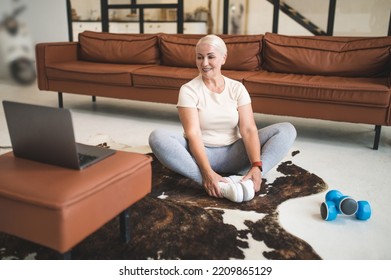 Mature Lady Performing A Yoga Exercise Indoor