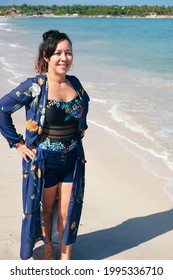 Mature Latina Woman Standing On The Beach Looking At The Camera