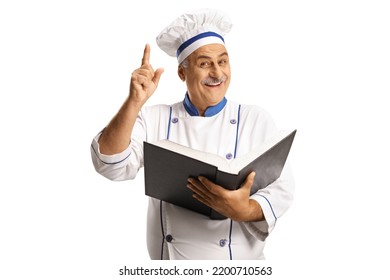 Mature Male Chef Holding A Cook Book Isolated On White Background