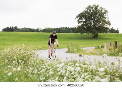 Mature Male Cyclist On Country Road