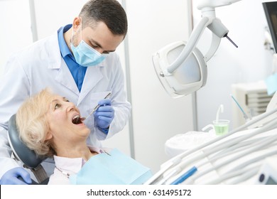 Mature Male Dentist Working With His Elderly Patient Senior Woman Visiting Dentist Having Dental Checkup At The Clinic Dentistry Occupation Treatment Medical Industry Healthcare People Insurance 