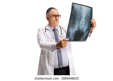 Mature Male Doctor Examining An X Ray Scan Isolated On White Background