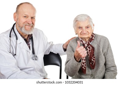 Mature male doctor taking care of disabled old woman on isolated background - Shutterstock ID 1032204031