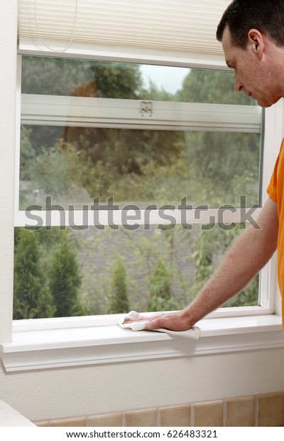 Mature Male Dusting Interior Window Sill Stock Photo Edit Now