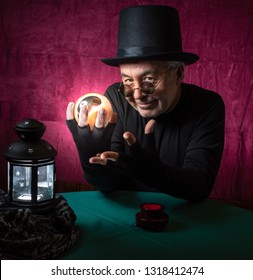 Mature male fortune teller, wearing a top hat holding a crystal ball and looking sinister. 