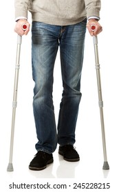 Mature Male Legs With Crutches.