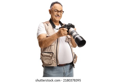 Mature Male Photo Journalist Holding A Professional Camera And Smiling At Camera Isolated On White Background