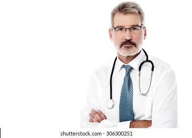 Mature Male Physician Posing With Stethoscope Over White