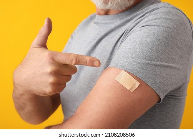 Mature man with applied nicotine patch on color background. Smoking cessation - Powered by Shutterstock