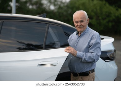 A mature man in a checkered shirt stands by the open door of a white car, exuding confidence and readiness for his journey. - Powered by Shutterstock