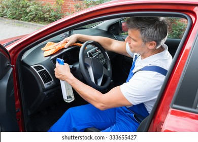 Mature Man Cleaning Car Interior