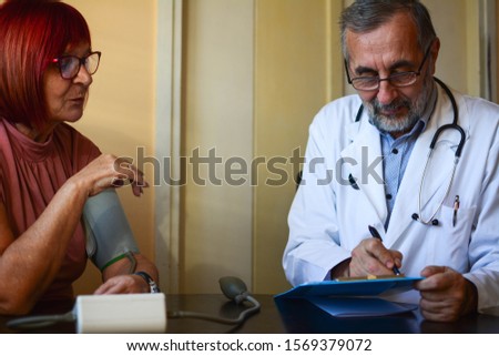 Similar – Female doctor showing an x-ray on the tablet