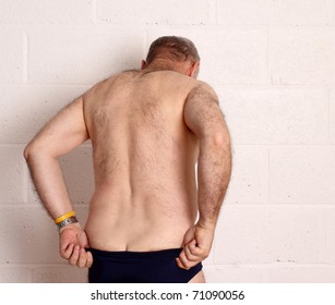 Mature Man Dressing Into His Swim Wear