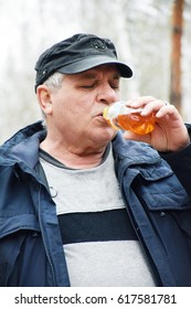Mature Man Drinking Fizzy Water