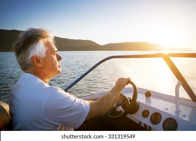 Mature Man Driving Speedboat