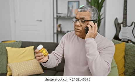 A mature man examines medication while talking on the phone in a cozy living room. - Powered by Shutterstock