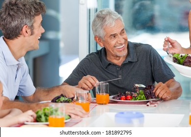 mature man with family dinner at table, home, parents, children and grandparents, happy smile lunch