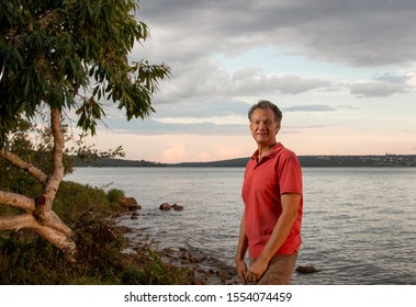 Mature Man Hanging Out At The Park Wearing Casual Clothes At Sundown