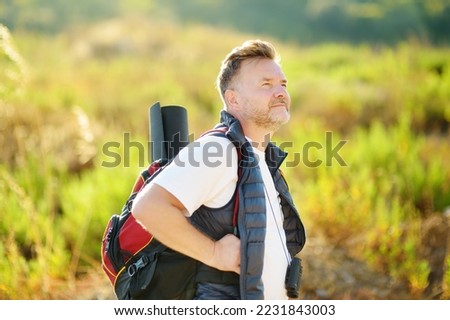 Similar – Image, Stock Photo Man traveling solo by train looking outside the window