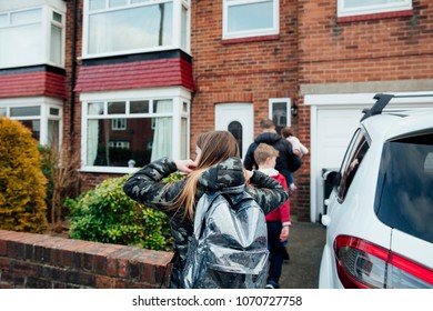 Mature Man And His Children Have Arrived Home After Picking Up His Eldest Daughter From School. 