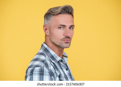 mature man with hoary hair on yellow background
