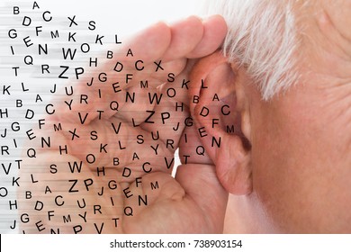 Mature Man Holding Hand Near Ear And Listening Carefully Alphabet Letters Fly