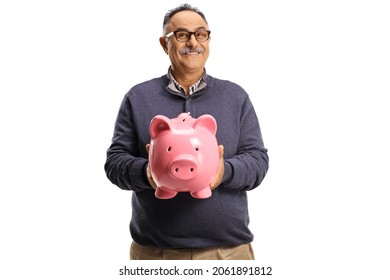 Mature man holding a pink piggy bank and smiling isolated on white background