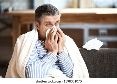 Mature man ill with flu at home - Powered by Shutterstock