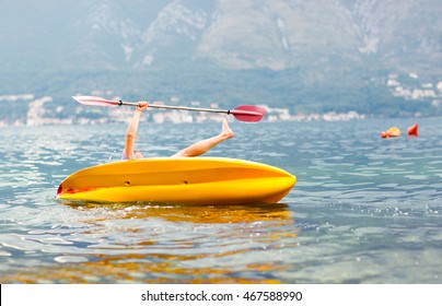 Mature Man Kayaking On The Sea, Falling Out Of The Kayak