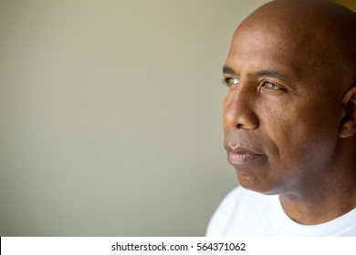 Mature Man Looking Away In Deep Thought.