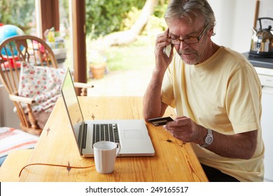 Mature Man Making On Line Purchase Using Credit Card