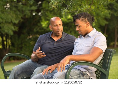 Mature Man Mentoring And Giving Advice To A Younger Man.