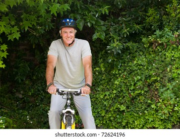 Mature Man Mountain Biking Outside