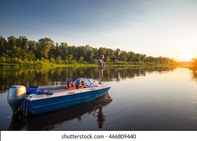 Mature man on a motor boat. Fishing.