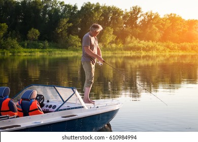 Mature Man On A Motor Boat. Fishing